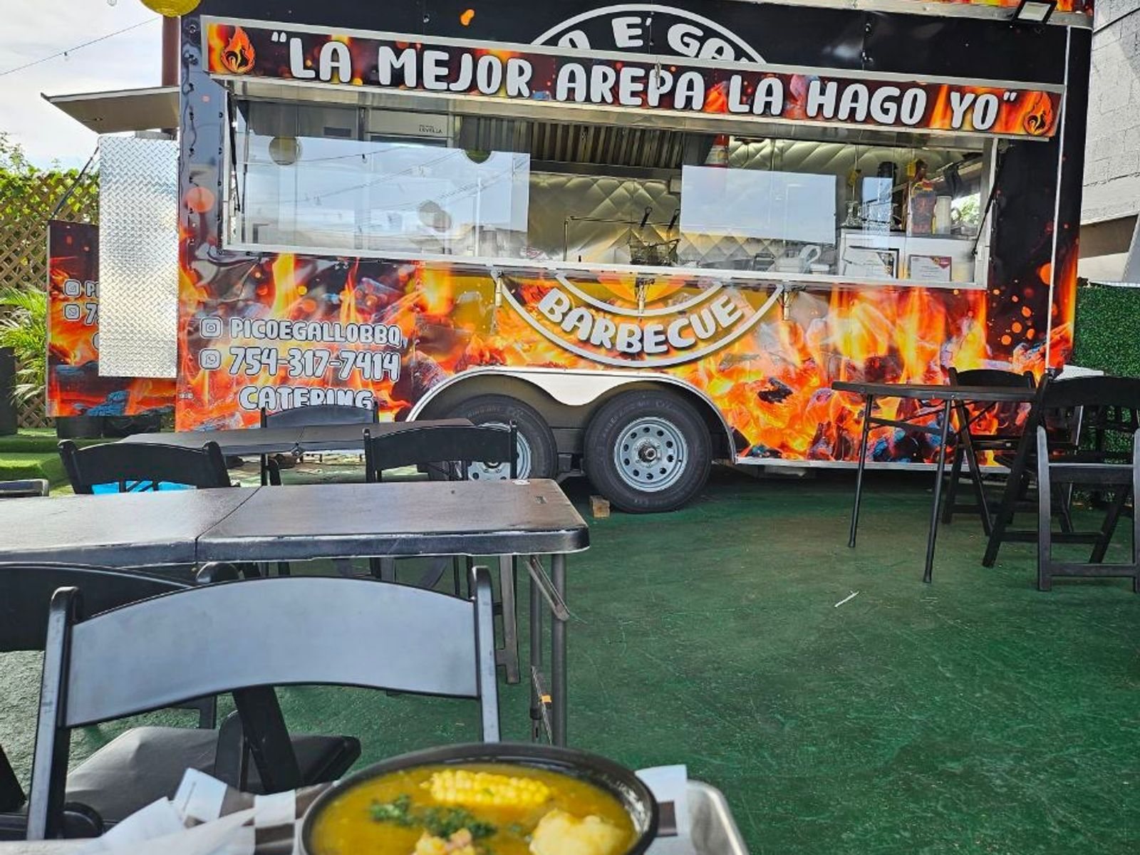 The Pico e Gallo BBQ food truck with its flame wrap and outdoor seating